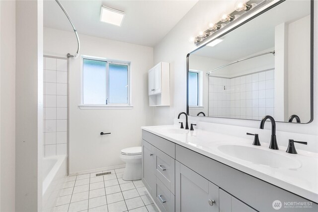 5208 Tumac Dr, Yakima, WA 98901 - full bathroom with toilet, visible vents, a sink, and tile patterned flooring