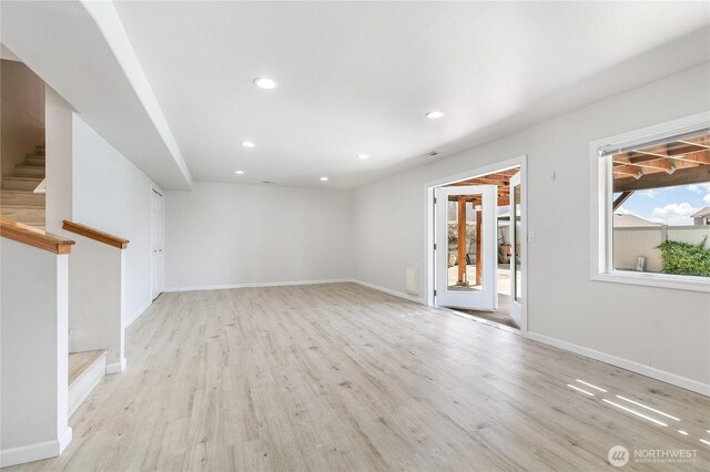 5208 Tumac Dr, Yakima, WA 98901 - unfurnished living room featuring stairway, baseboards, recessed lighting, and light wood-style flooring