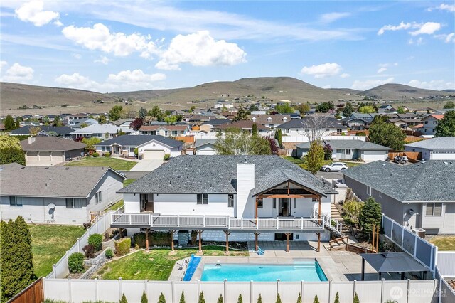 5208 Tumac Dr, Yakima, WA 98901 - exterior space with a balcony, a fenced backyard, a fenced in pool, a mountain view, and a residential view