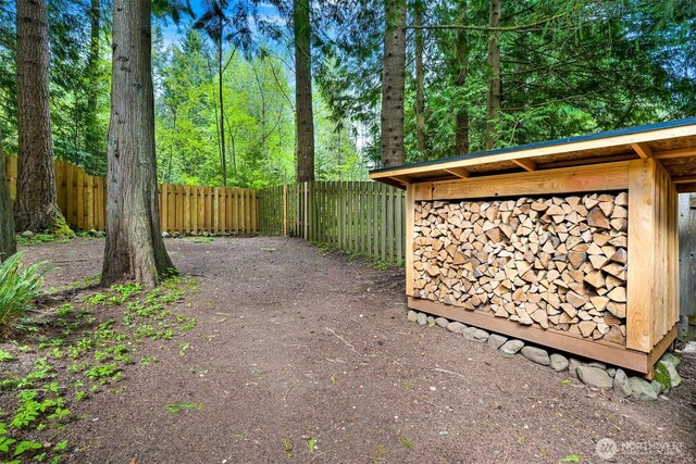 view of gate with a fenced backyard