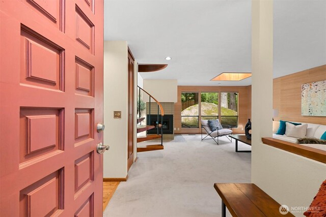 foyer with recessed lighting and light colored carpet
