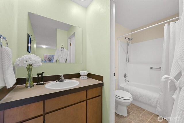 bathroom with vanity, shower / bathtub combination with curtain, tile patterned floors, and toilet