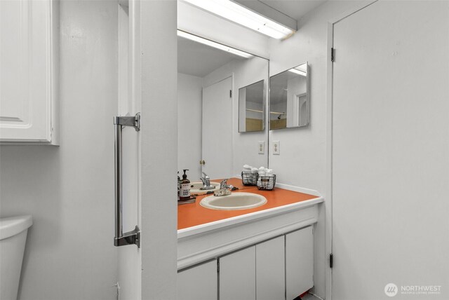 bathroom with vanity and toilet