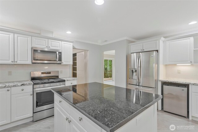 kitchen with recessed lighting, white cabinetry, and appliances with stainless steel finishes
