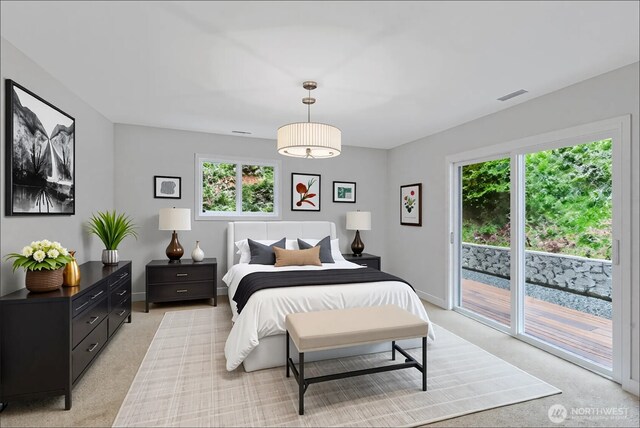 bedroom featuring visible vents, baseboards, light colored carpet, and access to exterior