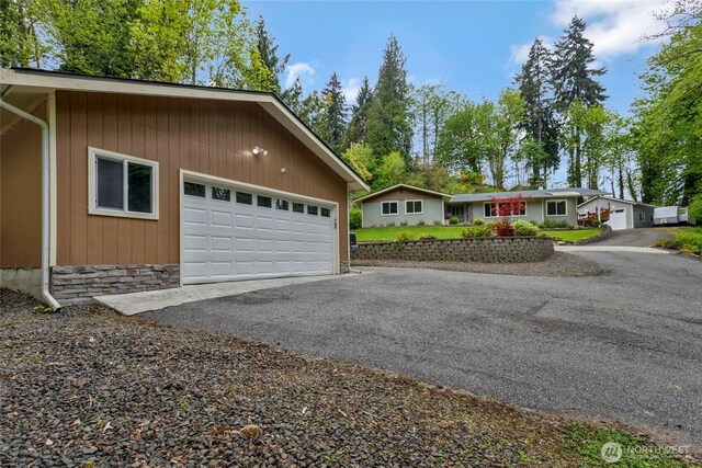 view of front of home with aphalt driveway