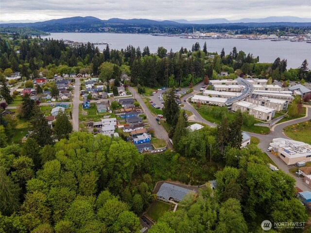 aerial view featuring a water and mountain view