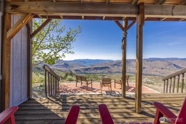 wooden terrace with a mountain view