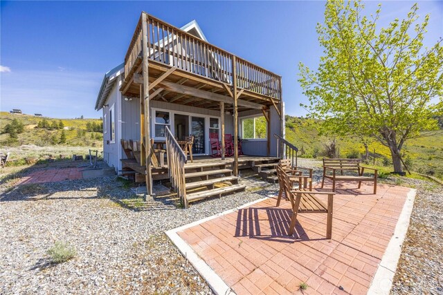 rear view of house with a patio and a deck