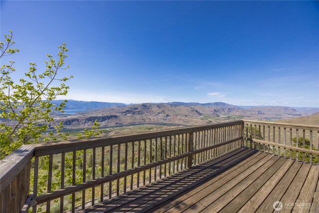 wooden terrace featuring a mountain view