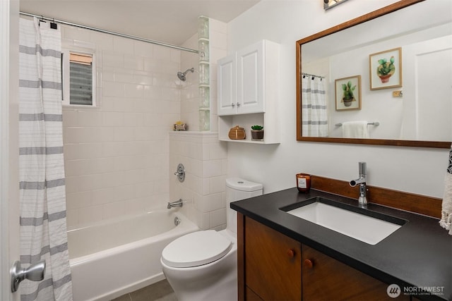 bathroom featuring toilet, shower / tub combo with curtain, and vanity