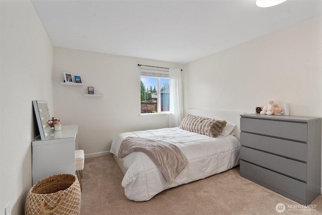 carpeted bedroom with baseboards