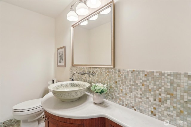 1238 E Newton St, Seattle, WA 98102 - half bath with decorative backsplash, vanity, and toilet