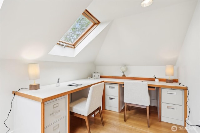 1238 E Newton St, Seattle, WA 98102 - office with built in study area, vaulted ceiling, light wood-style flooring, and a skylight
