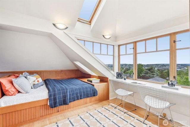 1238 E Newton St, Seattle, WA 98102 - bedroom with a skylight, lofted ceiling, wood finished floors, and an office area