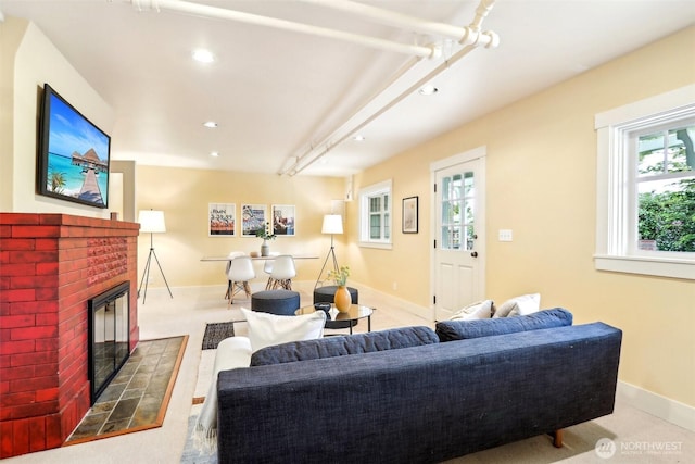 1238 E Newton St, Seattle, WA 98102 - living area featuring a brick fireplace, baseboards, and recessed lighting