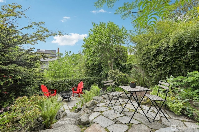1238 E Newton St, Seattle, WA 98102 - view of patio / terrace featuring a fire pit