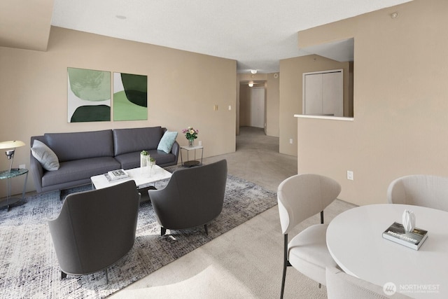 living area featuring carpet flooring
