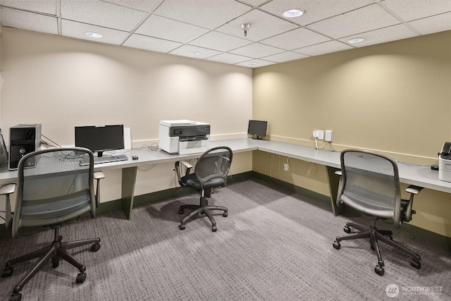 home office featuring baseboards, carpet flooring, and a paneled ceiling
