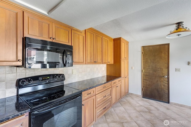 kitchen with decorative backsplash, a textured ceiling, light tile patterned floors, black appliances, and dark stone counters