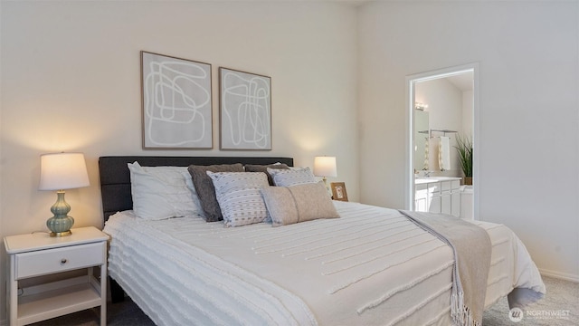 carpeted bedroom with connected bathroom