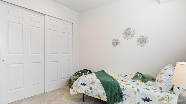 carpeted bedroom featuring a closet