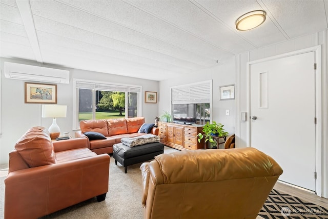 living area with a wall mounted AC and a textured ceiling