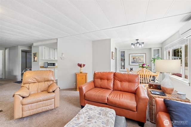 carpeted living area with a wall mounted air conditioner and a notable chandelier