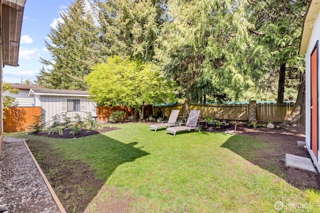 view of yard with a fenced backyard
