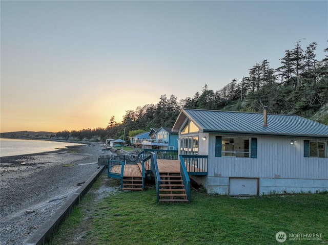 1409 Fossil Ln, Oak Harbor, WA 98277 - exterior space with stairs, a wooden deck, and a yard