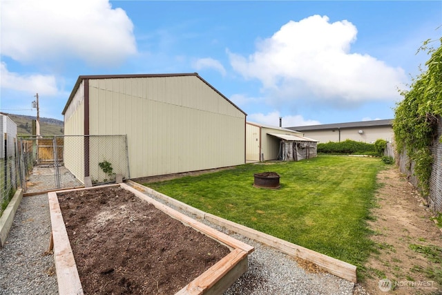 916 Sunset Dr, Brewster, WA 98812 - view of yard with a fire pit and a garden