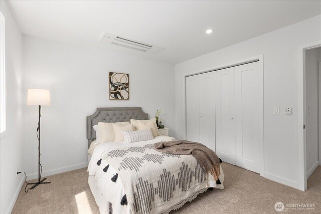 carpeted bedroom with baseboards, a closet, recessed lighting, and visible vents