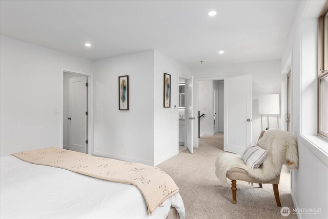 bedroom with recessed lighting, baseboards, and light colored carpet