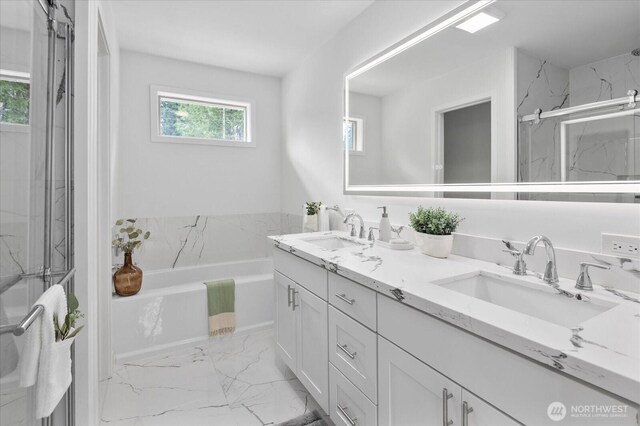 full bathroom featuring a sink, a marble finish shower, a bath, and marble finish floor