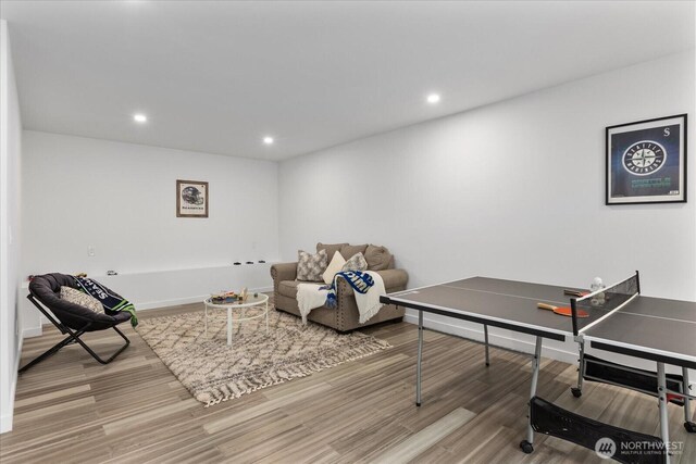 rec room with recessed lighting, baseboards, and wood finished floors