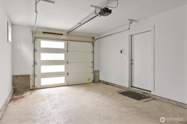 garage featuring a garage door opener