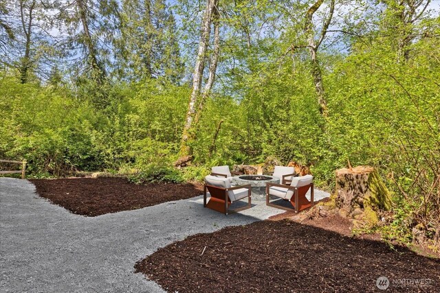 exterior space featuring a patio area and an outdoor fire pit