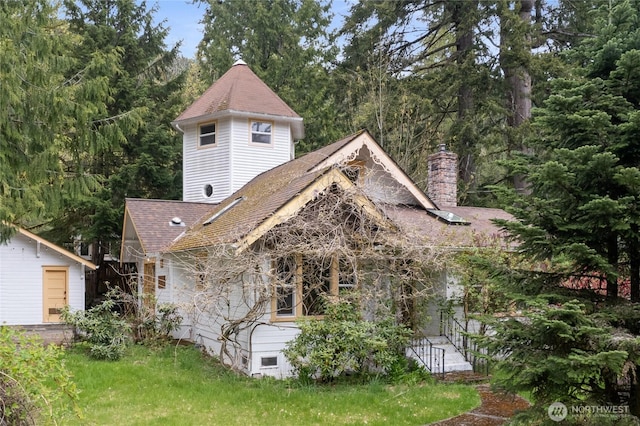 33823 State Route 706 Unit 1, Ashford, WA 98304 - view of front facade featuring a shingled roof and a chimney