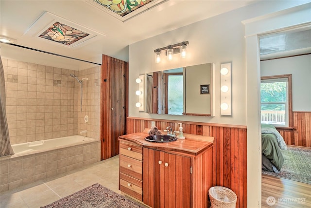 33823 State Route 706 Unit 1, Ashford, WA 98304 - bathroom with a wainscoted wall, vanity, tile patterned floors, ensuite bathroom, and tiled shower / bath combo