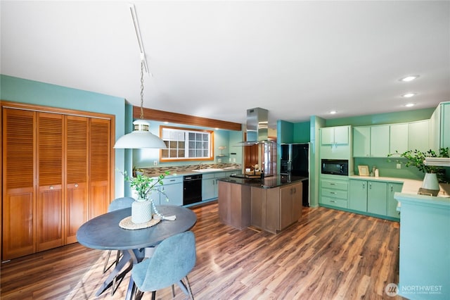 313 Willapa Pl, La Conner, WA 98257 - kitchen featuring dark wood-style flooring, island range hood, a center island, a sink, and black appliances