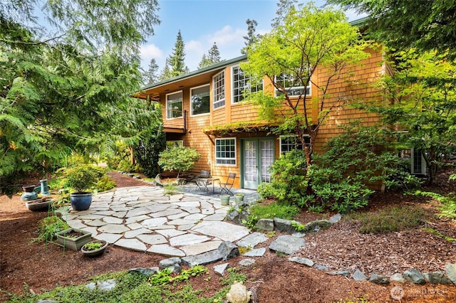 313 Willapa Pl, La Conner, WA 98257 - back of property with french doors and a patio area