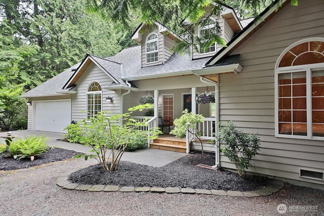 1180 Cedar Cir, Langley, WA 98260 - view of front of house with roof with shingles, a garage, and a porch