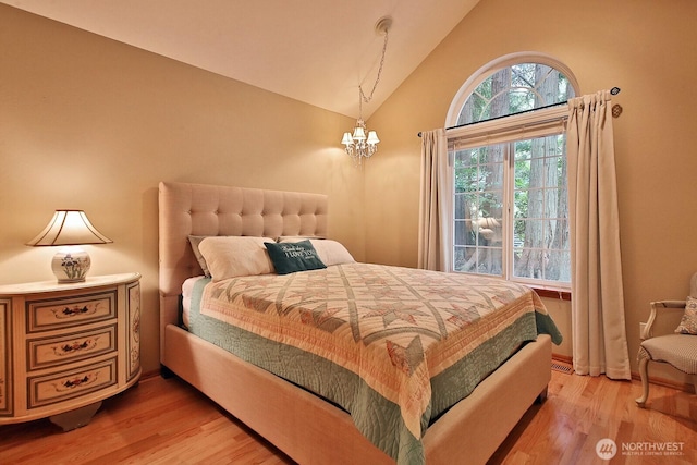 1180 Cedar Cir, Langley, WA 98260 - bedroom featuring light wood-style floors, a chandelier, and high vaulted ceiling