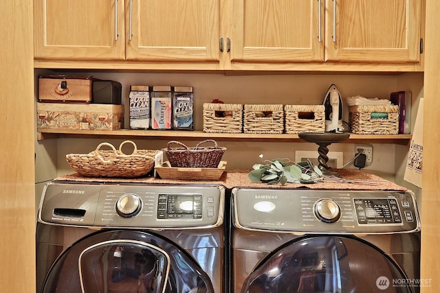 1180 Cedar Cir, Langley, WA 98260 - laundry room featuring washer and clothes dryer and cabinet space