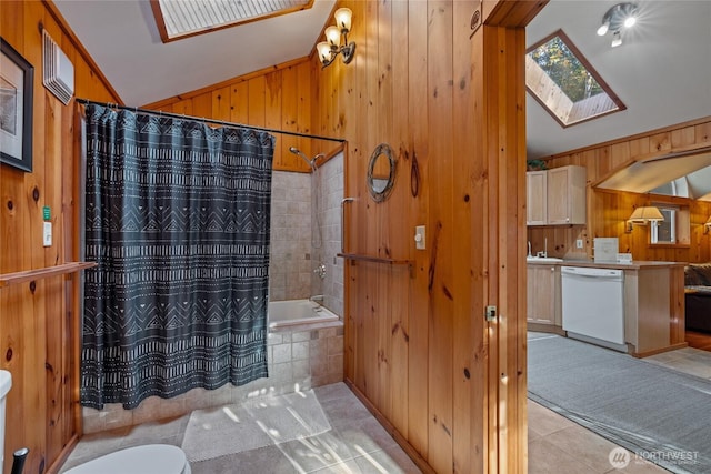 33823 State Route 706 E Unit 2, Ashford, WA 98304 - full bath with wooden walls, tile patterned flooring, toilet, tiled shower / bath combo, and lofted ceiling with skylight