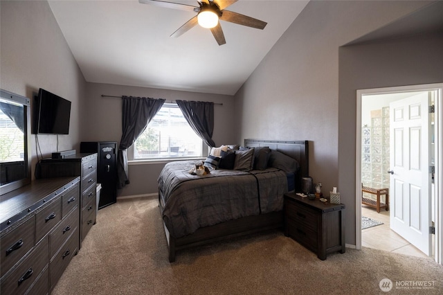 bedroom featuring baseboards, ceiling fan, light colored carpet, and lofted ceiling