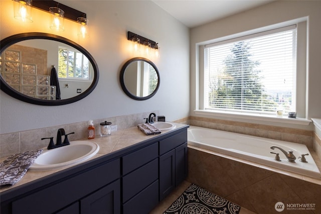 full bath with double vanity, tile patterned flooring, a sink, and a bath