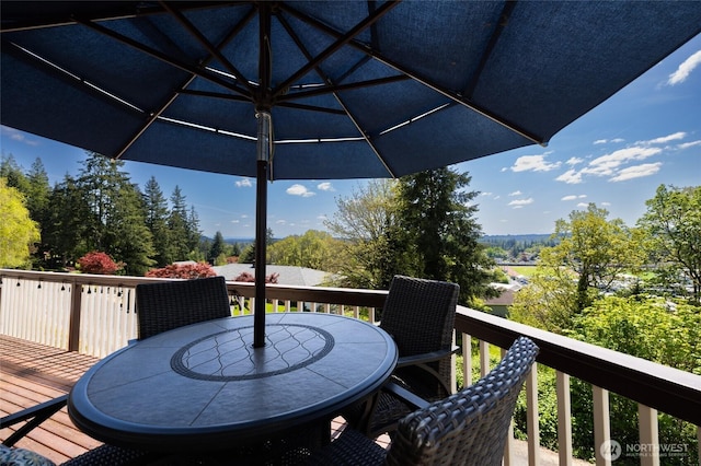 deck with outdoor dining area