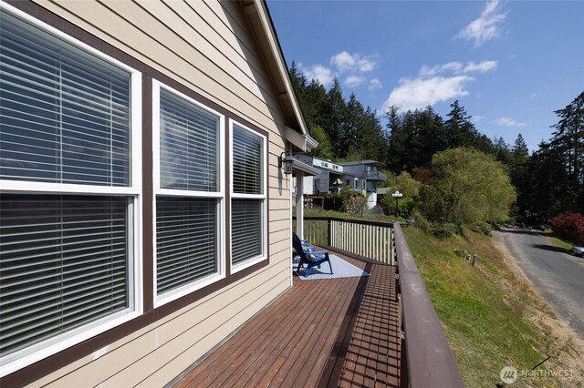 view of property exterior with a deck