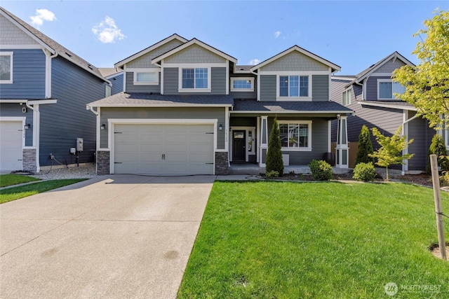 craftsman inspired home featuring a front yard, roof with shingles, an attached garage, driveway, and a porch